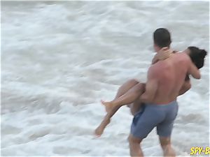 rosy bathing suit inexperienced bra-less spycam Beach chicks