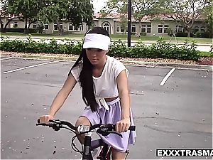 super-cute Latina cycler learns to ride sausage